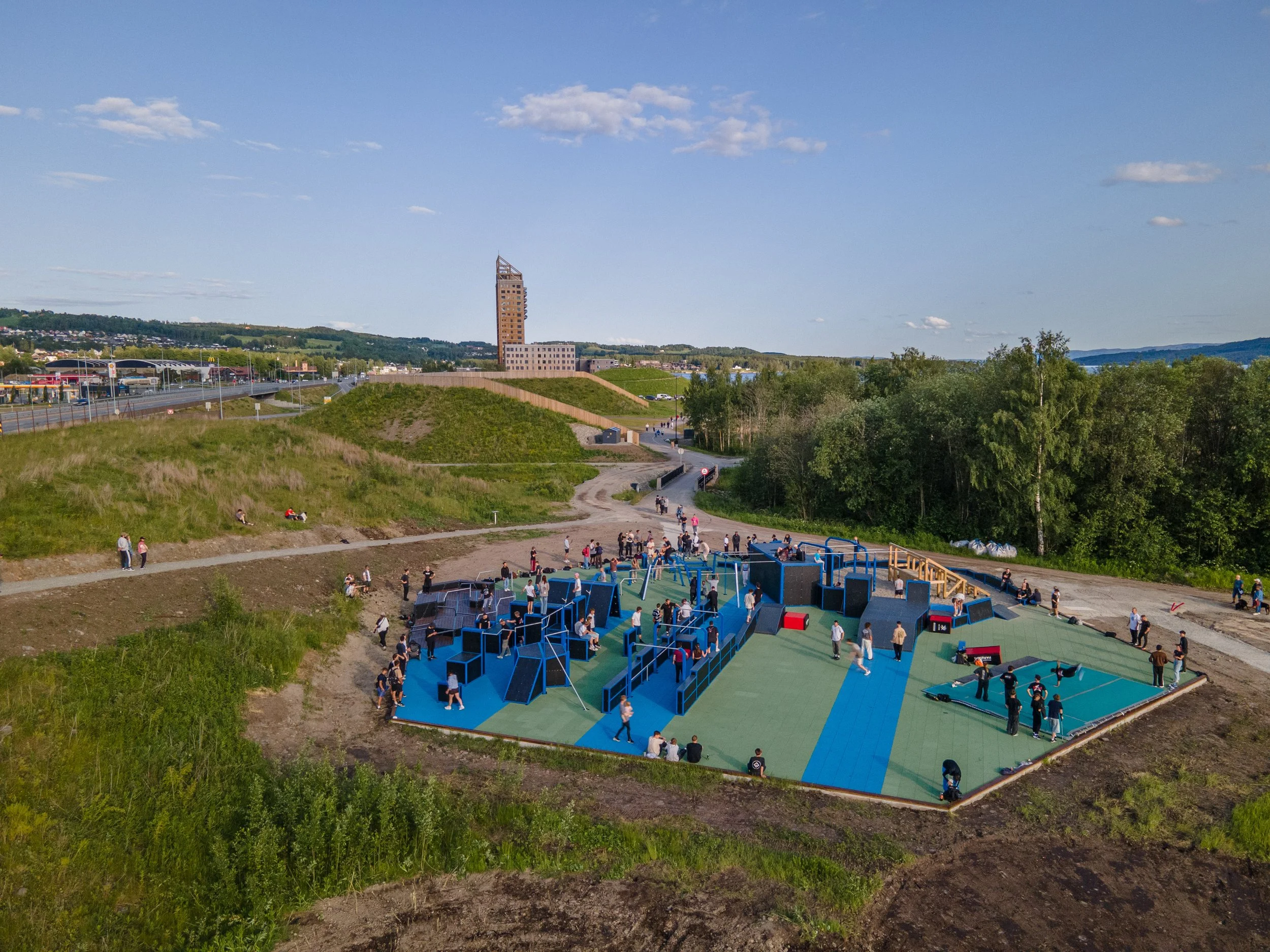 Aerial view of a busy Exeo FlowParks parkour park in active use